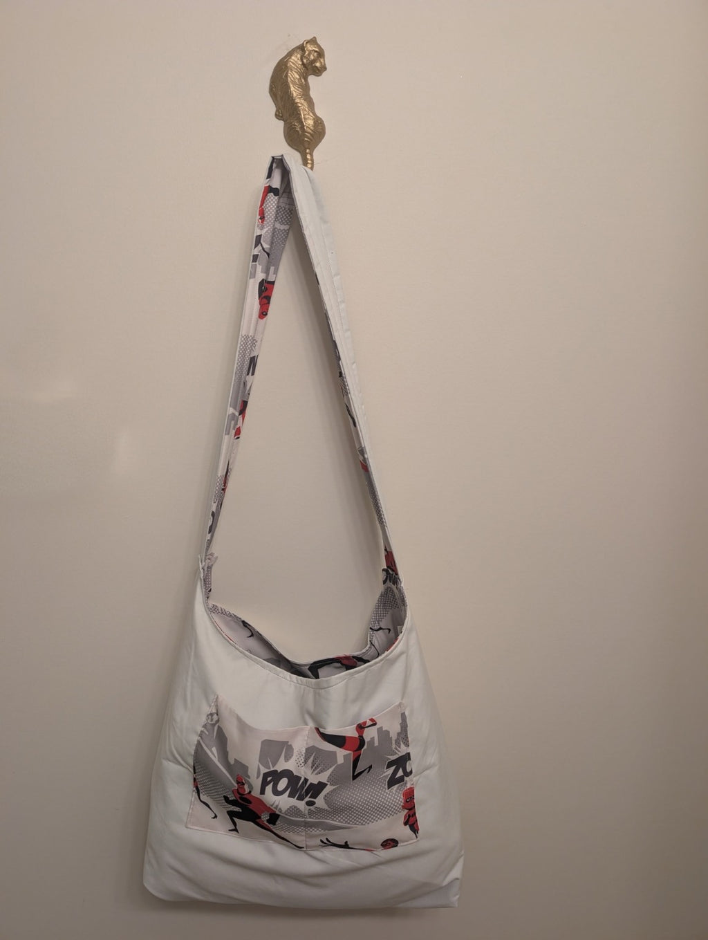 Reversible handmade shoulder bag shown with the pale solid side out and print pocket