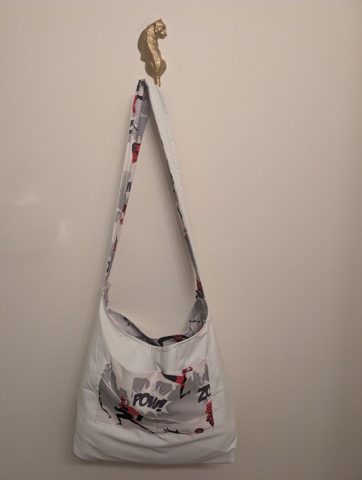 Reversible handmade shoulder bag shown with the pale solid side out and print pocket